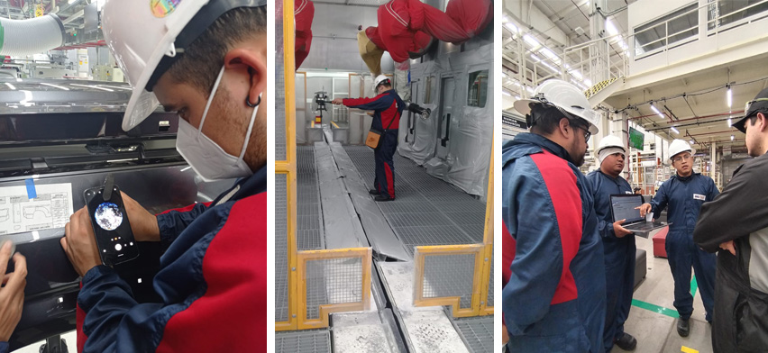 Equipo técnico industrial inspeccionando y ajustando sistema de filtración en cabina de pintura automotriz, realizando revisión de filtros, sellos y flujo de aire para mejorar la calidad del aire y el acabado de pintura sin detener la producción.